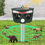 Jinyi solar animal repeller: black solar animal repeller on stake.