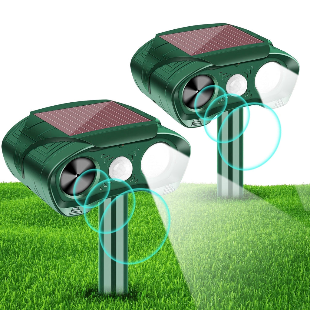 Solar animal repeller 2 pack: two green solar motion-sensor repellers.