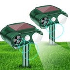 Solar animal repeller 2 pack: two green solar motion-sensor repellers.