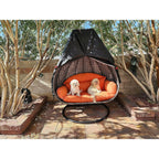 Double egg chair cover: open-front covered double chair outdoors.