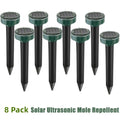 Solar mole repellent stakes: eight green solar deterrent stakes.