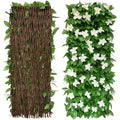 Expandable ivy privacy fence: artificial ivy trellis with white flowers.
