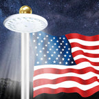 Solar flagpole light: white circular flagpole light illuminating flag.
