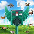 Motion sensor animal repeller: green winged solar repeller on stake.