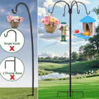 Garden shepherds hook: four-hook hanger holding pots and bird feeder.