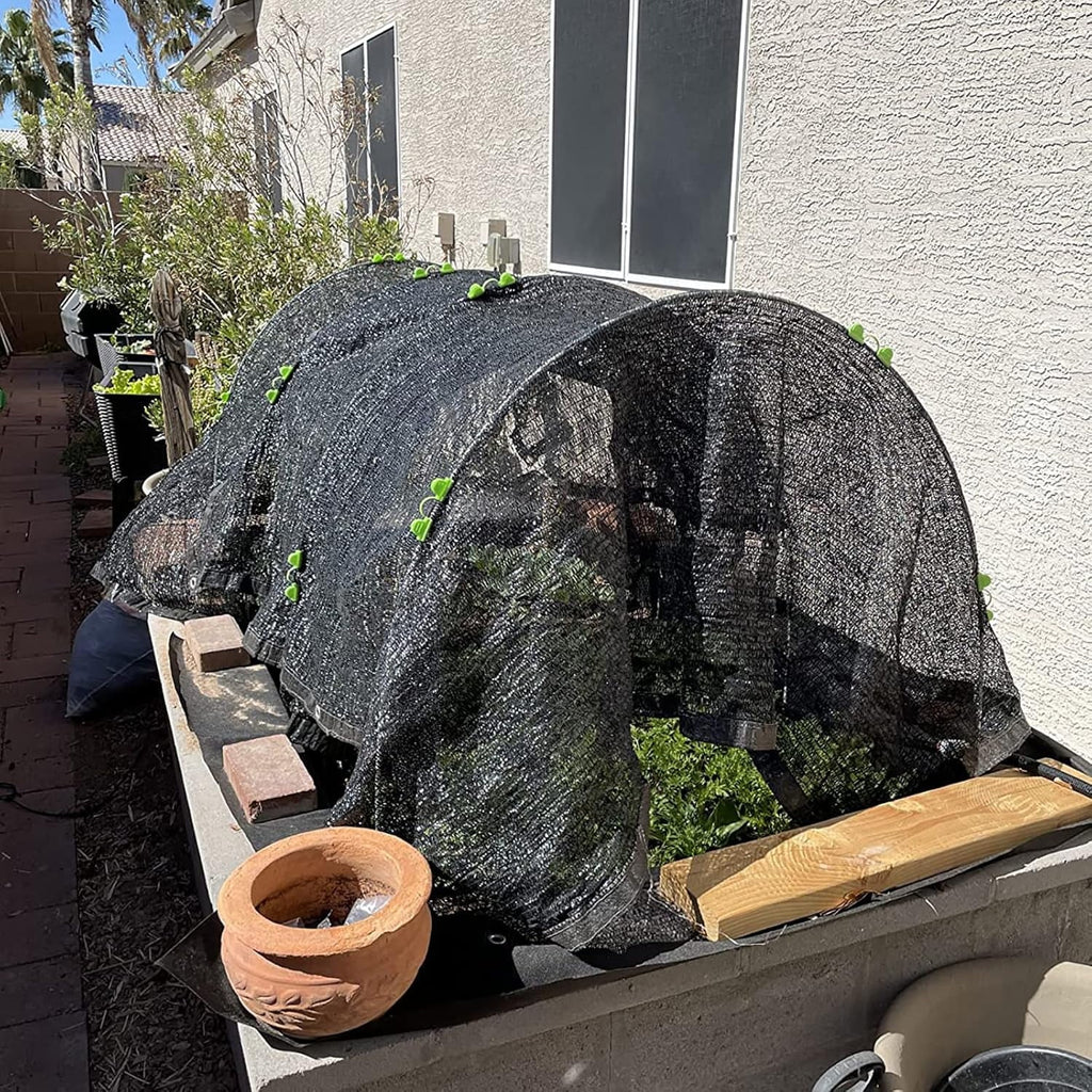 Fiberglass garden hoops: shade cloth over garden hoops.